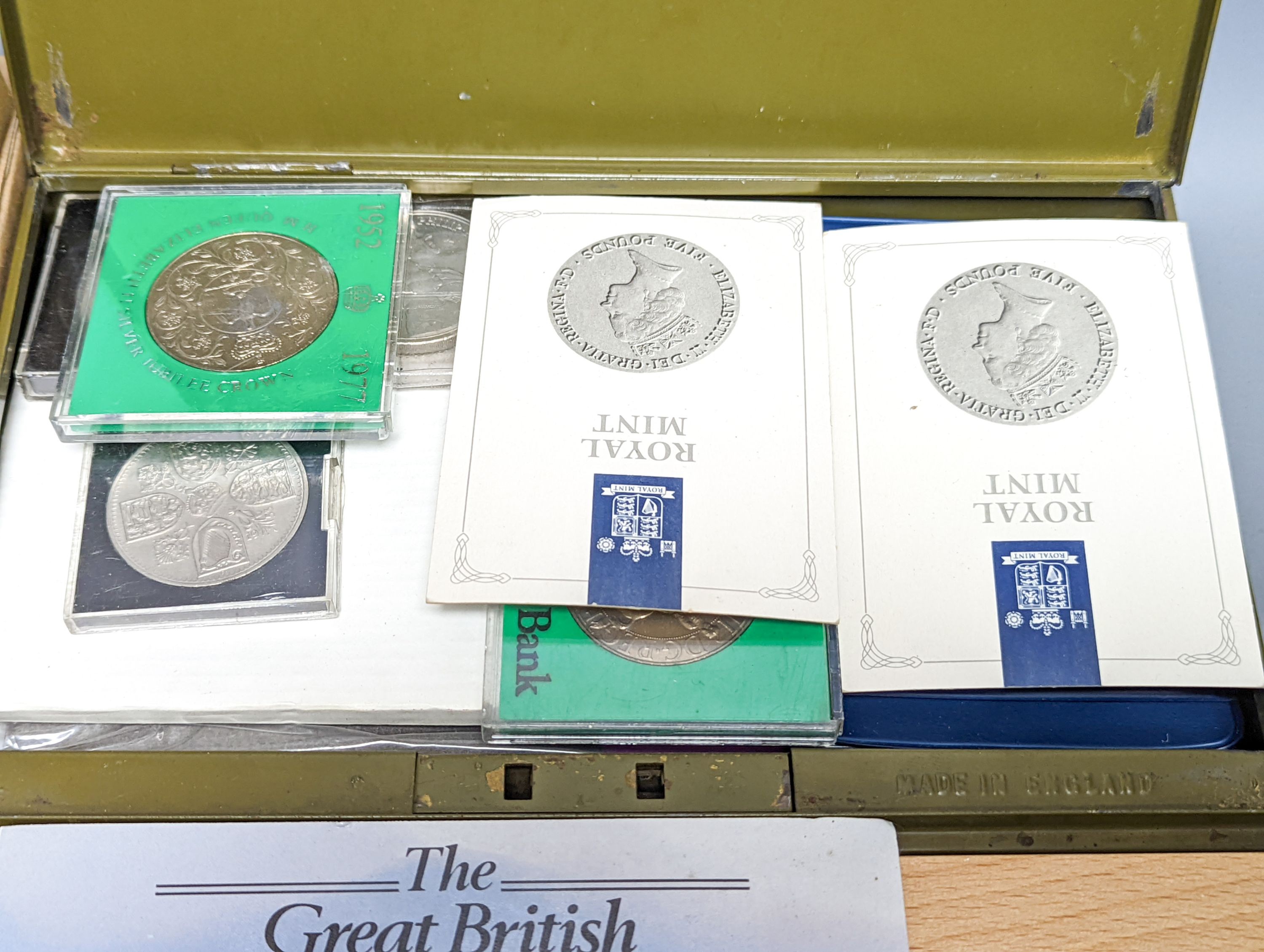 A group of assorted collector's coins, including 1911 gold half sovereign.